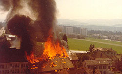 
The burning stables and garage, seen from a window in the 