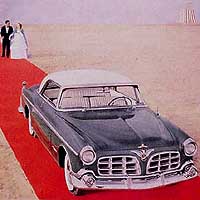 1955 Imperial ad, green car on airport runway.